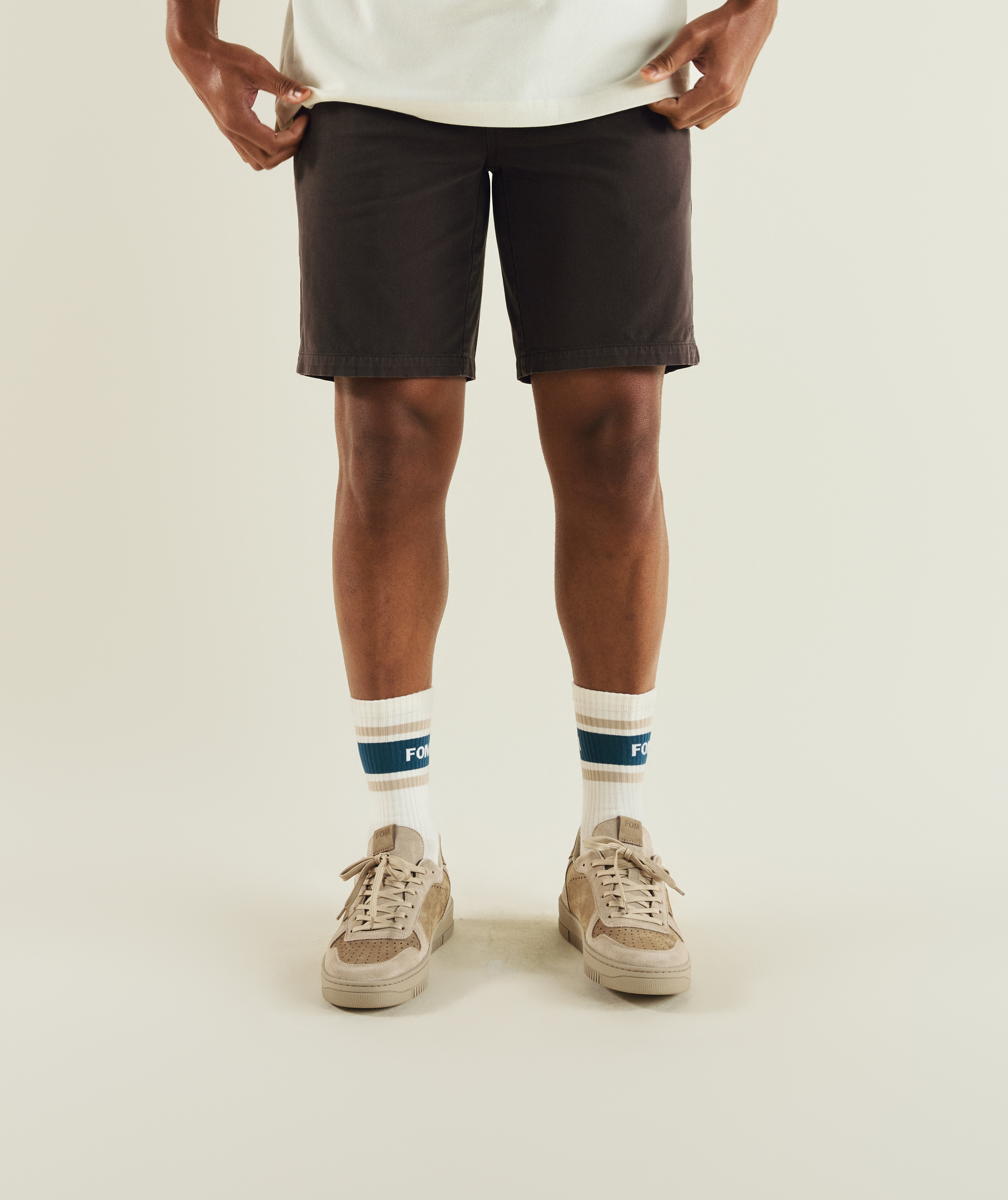 Man wearing FOM cotton twill chino shorts in charcoal