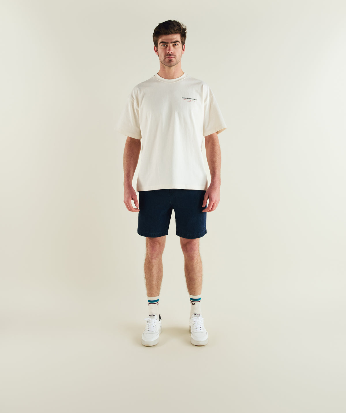 Man wearing FOM x Kolisi cotton twill shorts in dark indigo