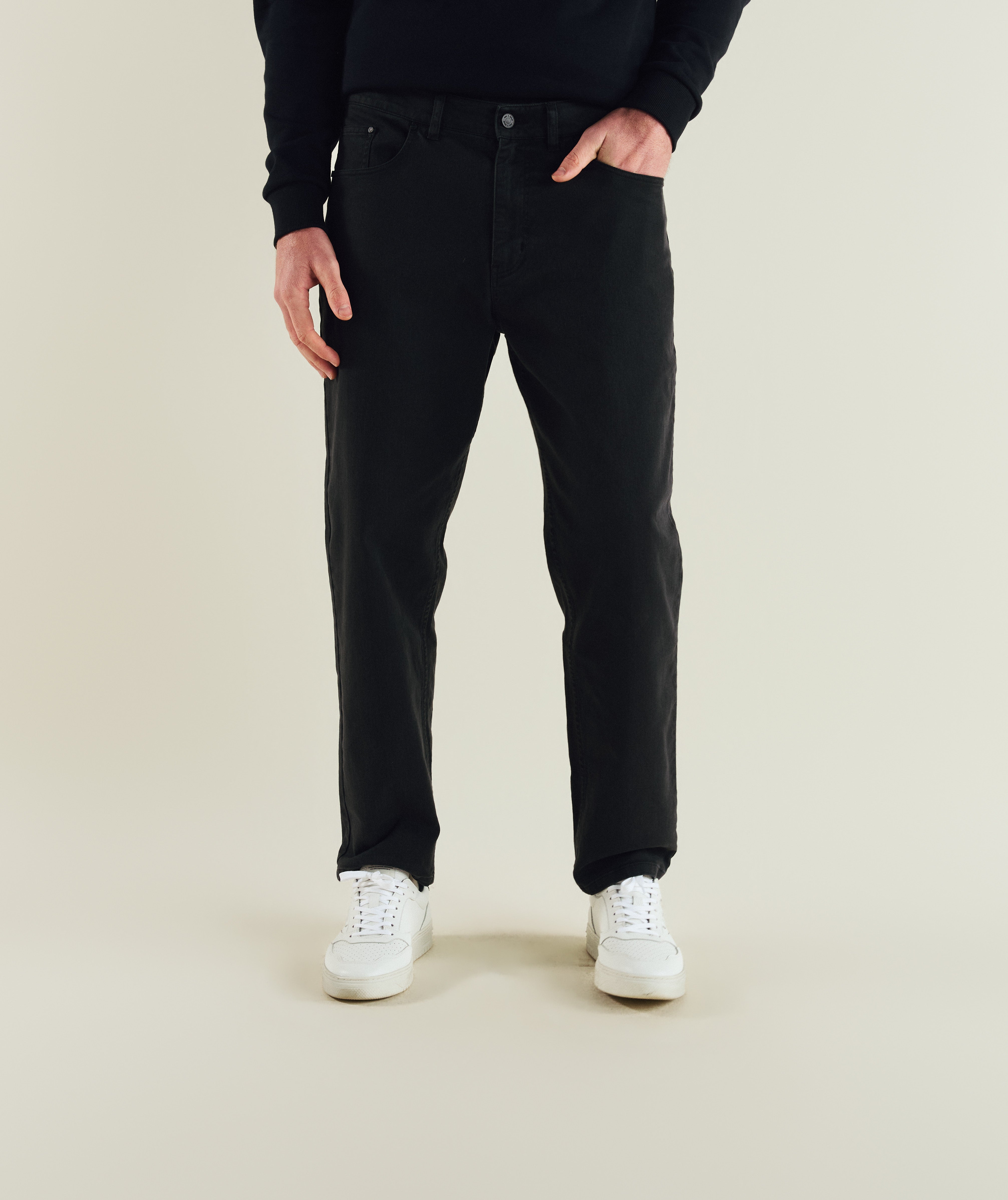 Man wearing FOM x Kolisi denim pants in black