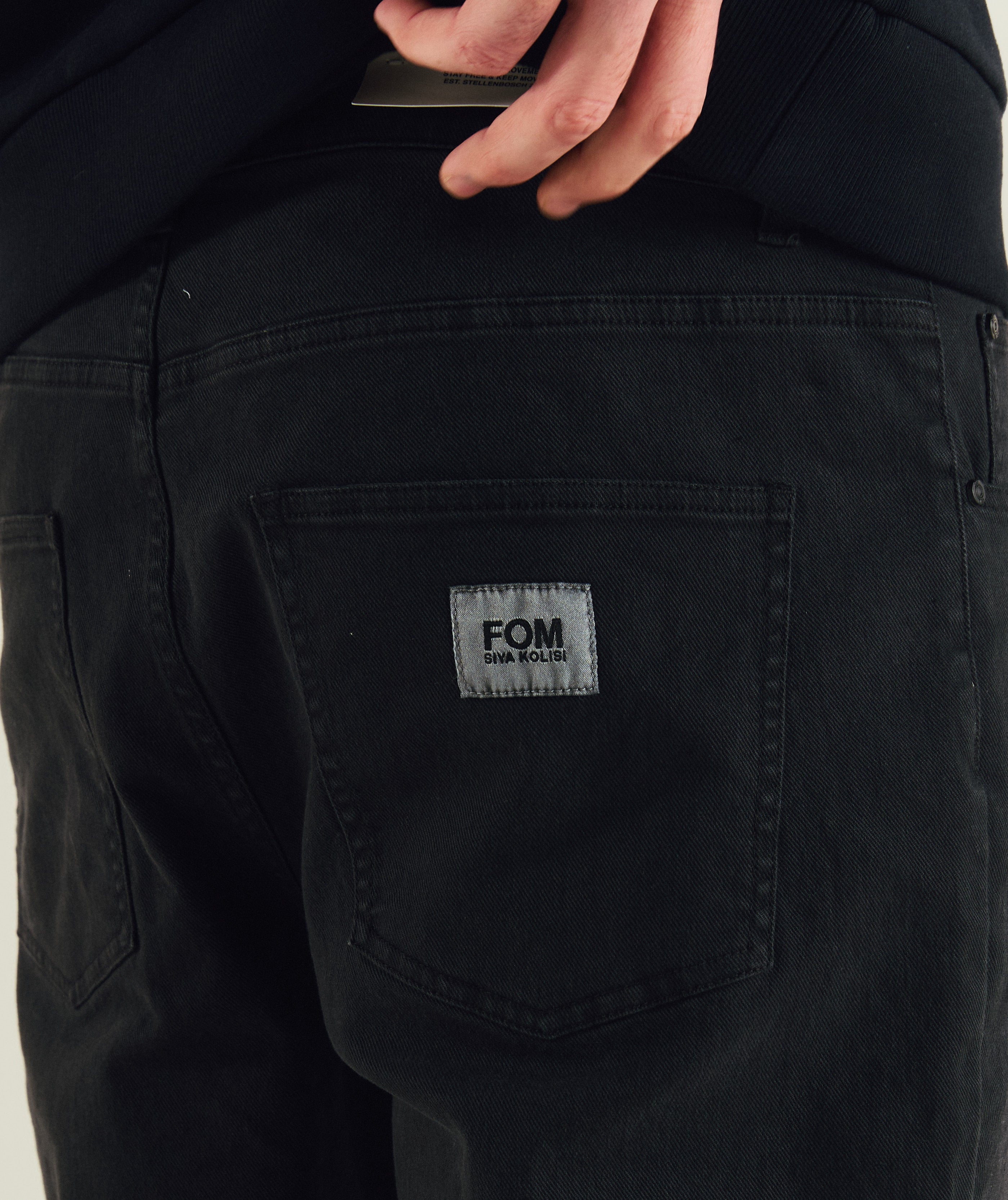 FOM x Kolisi denim pants in black, on-model view