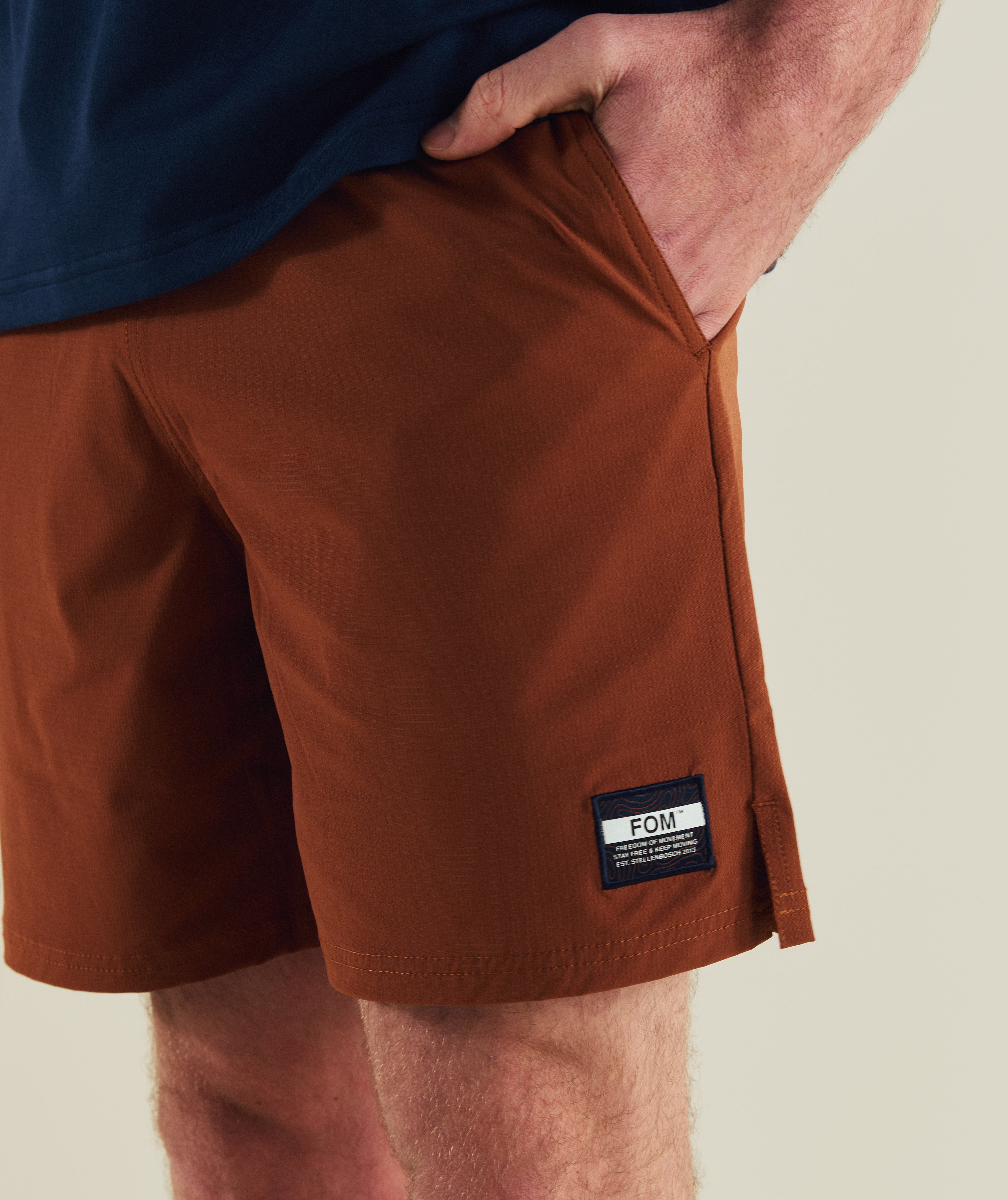 FOM freemotion micro ripstop shorts in rust, on-model view