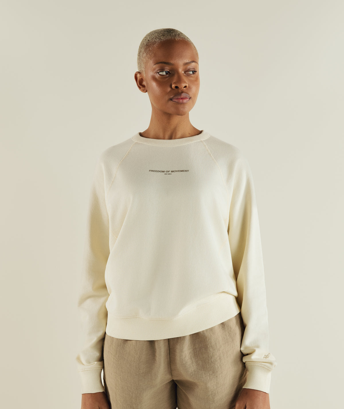 Woman wearing FOM ladies textured crew neck sweat in ivory