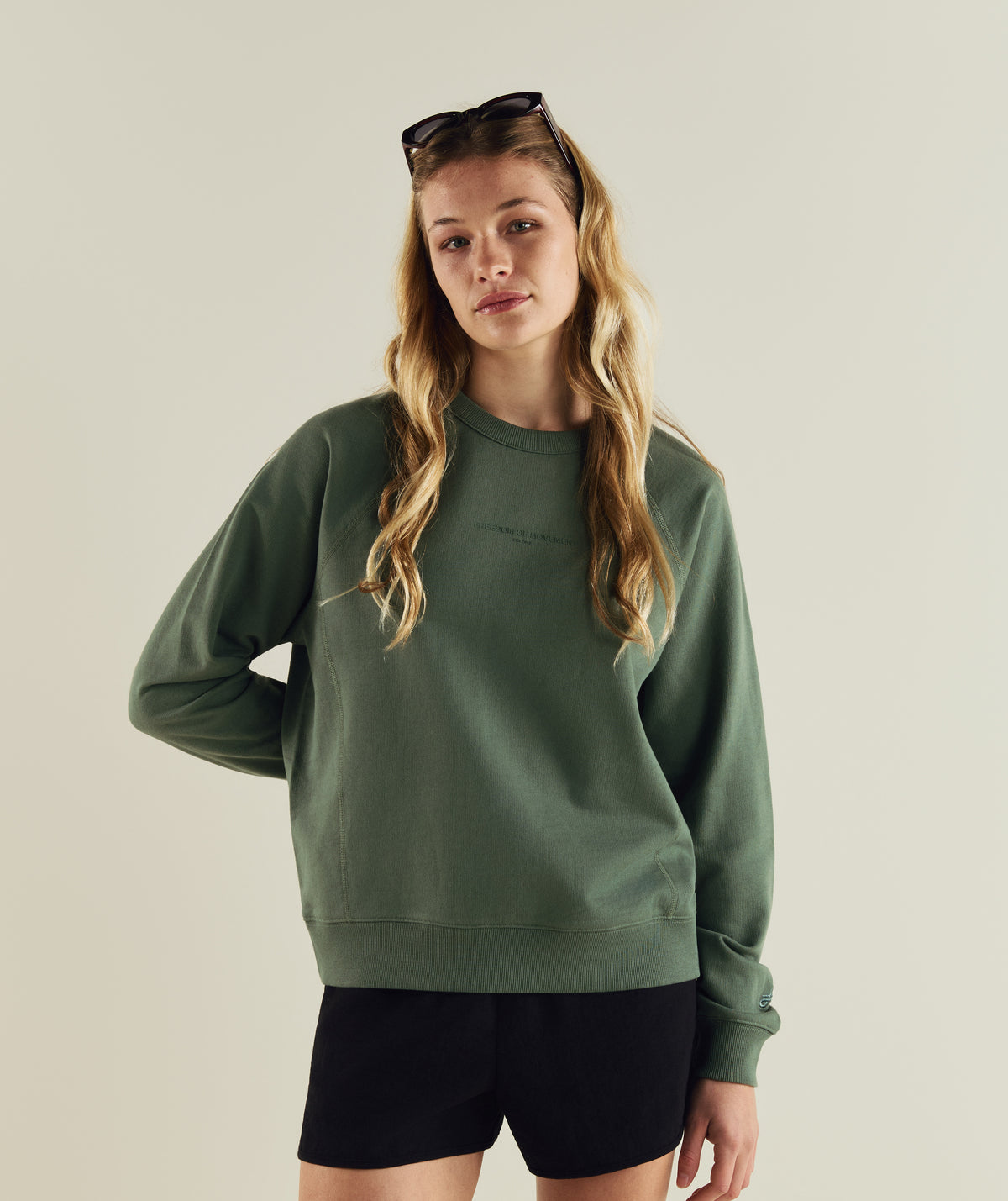 Woman wearing FOM ladies textured crew neck sweat in sage green