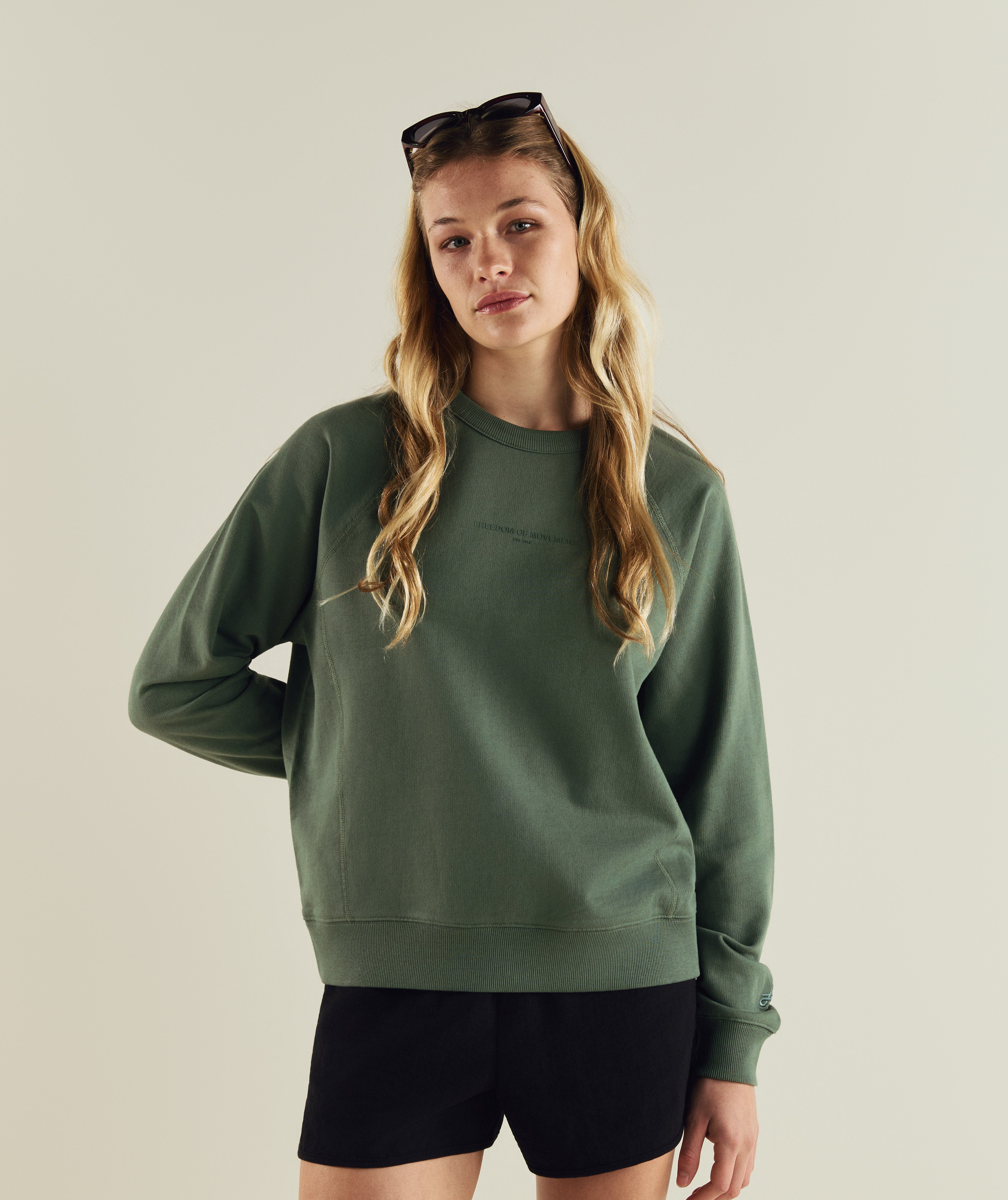 Woman wearing FOM ladies textured crew neck sweat in sage green