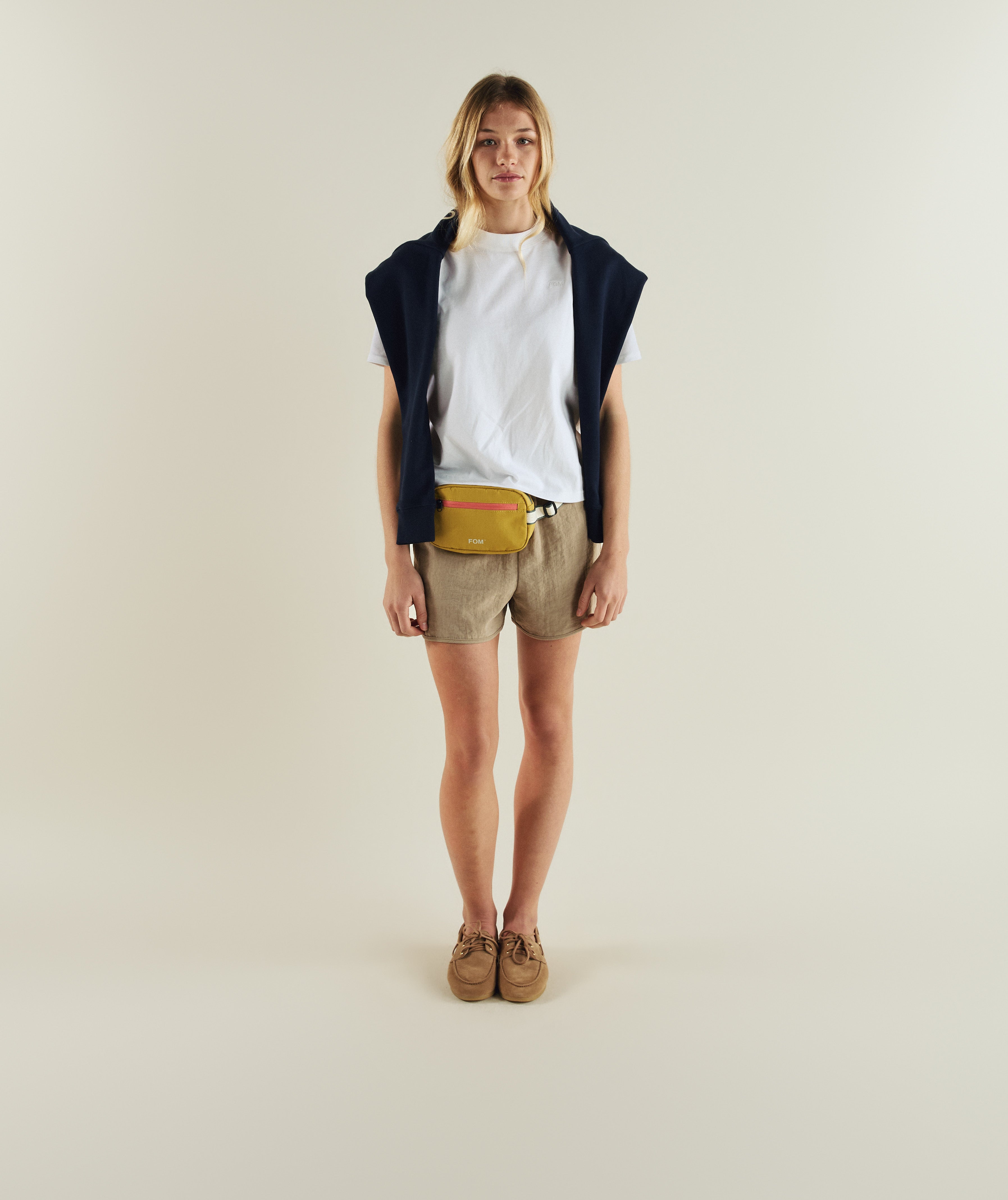 Woman wearing FOM ladies regular tee in white