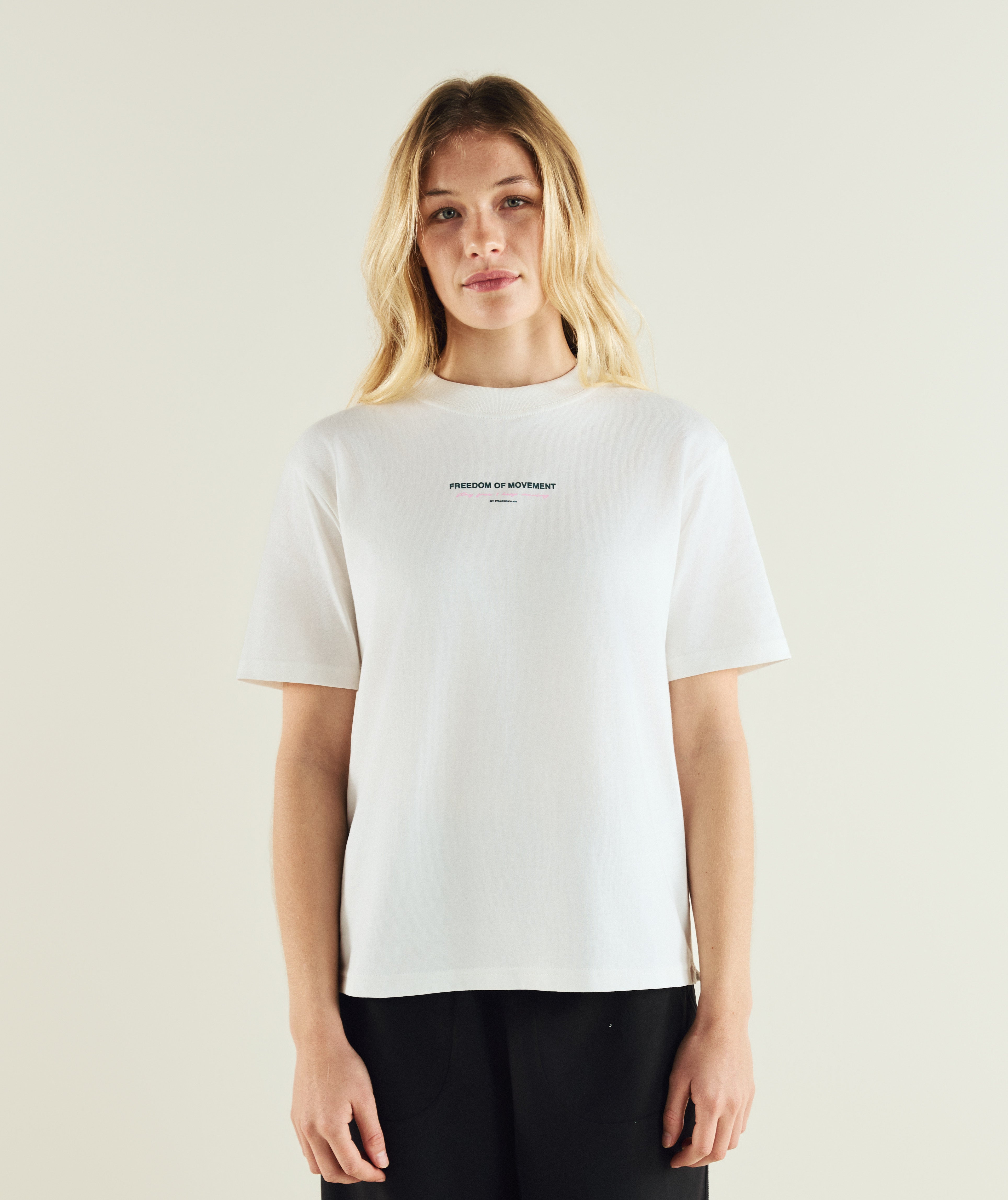 Woman wearing FOM ladies flower graphic tee in ivory