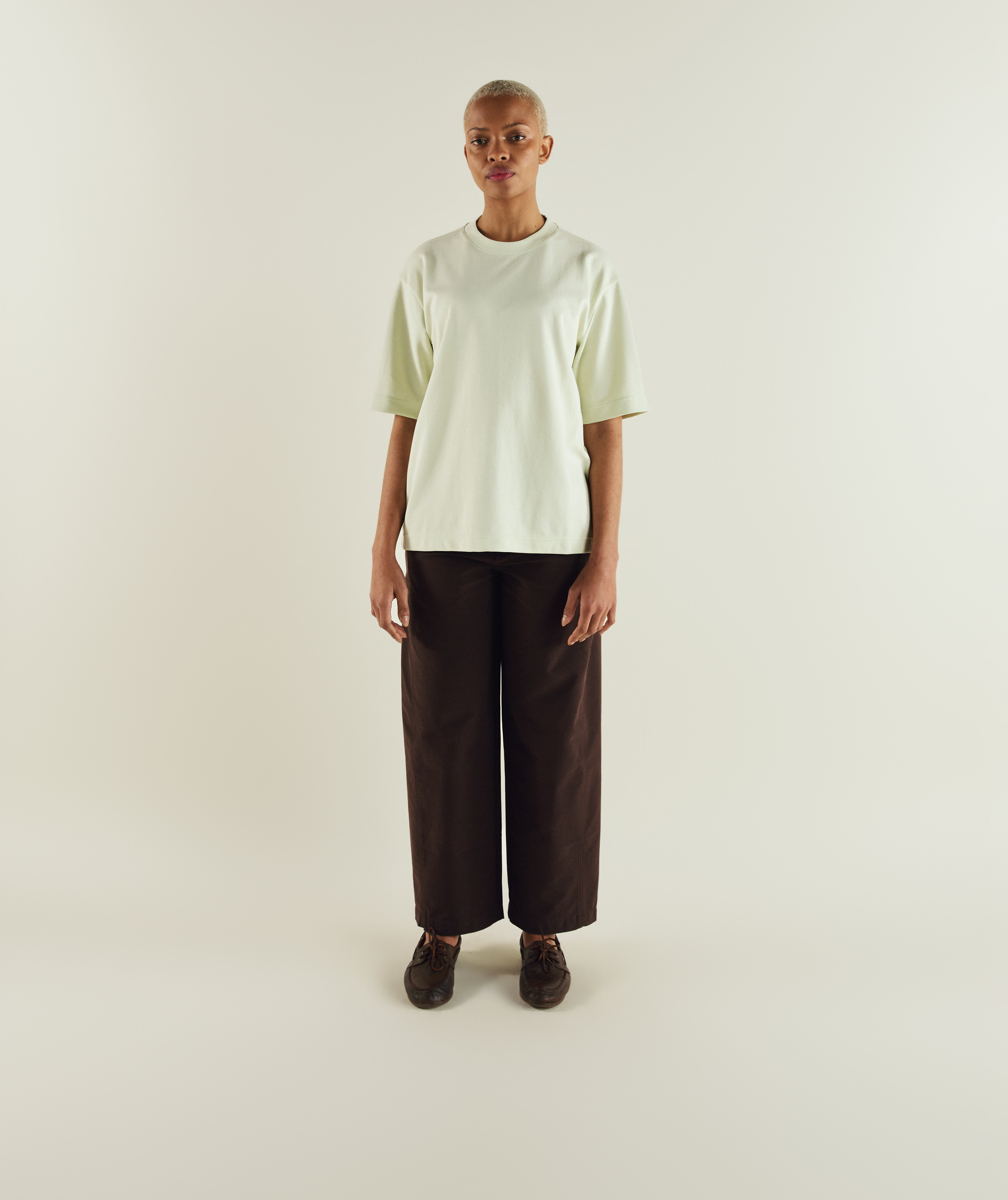 Woman wearing FOM ladies oversized interlock tee in aloe