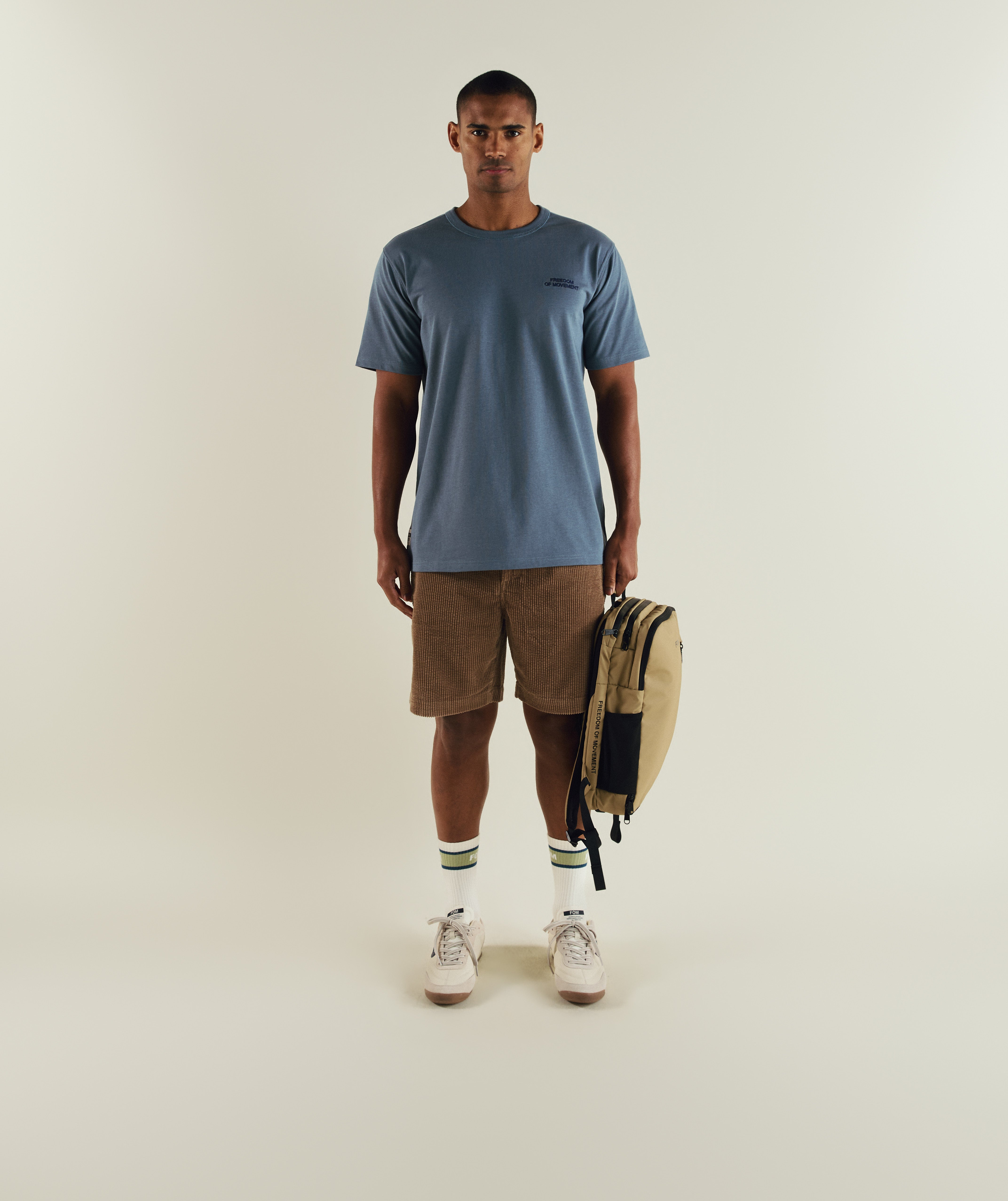 Man wearing FOM regular cotton tee in stormy weather