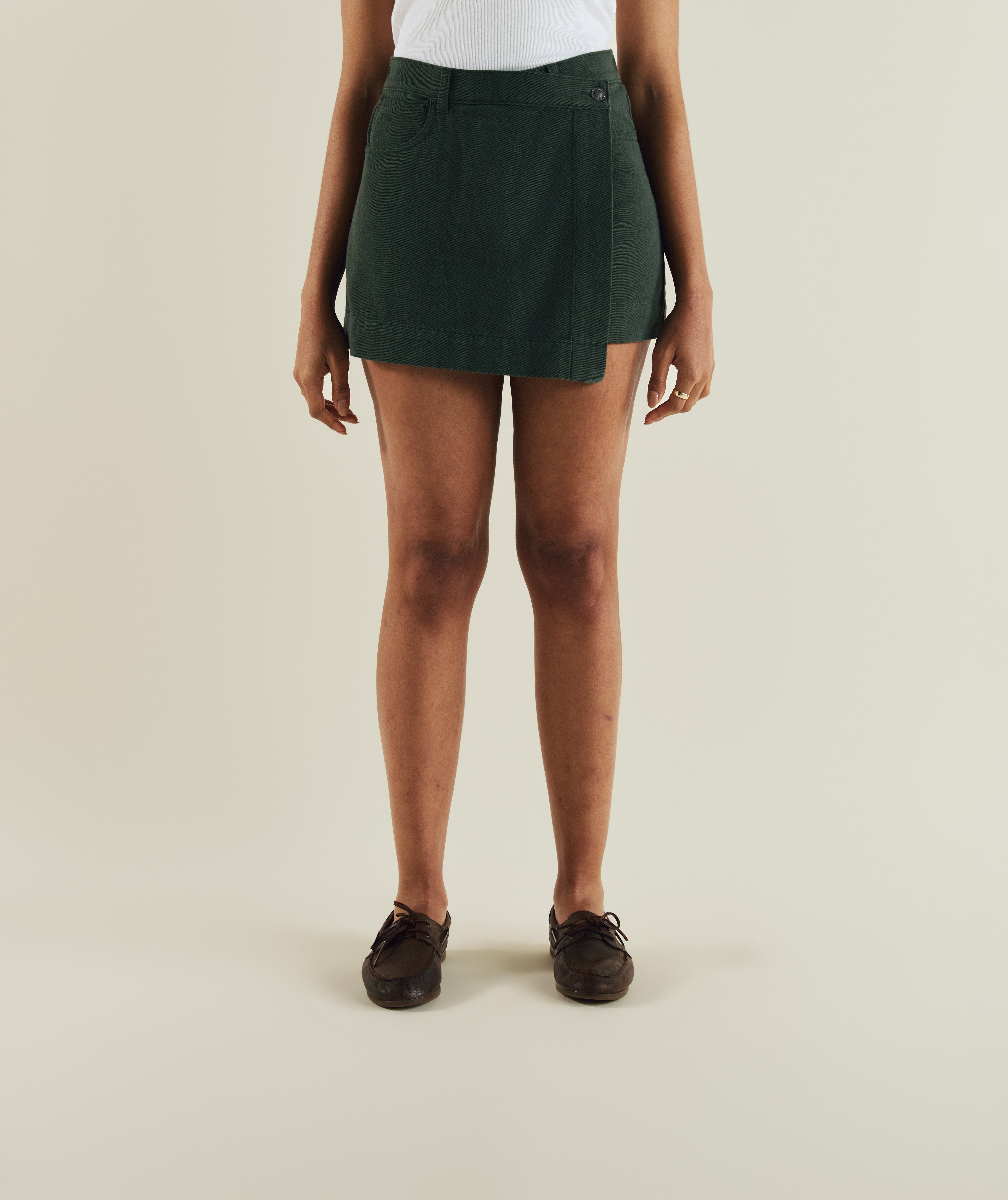 Woman wearing FOM ladies skort in dark green