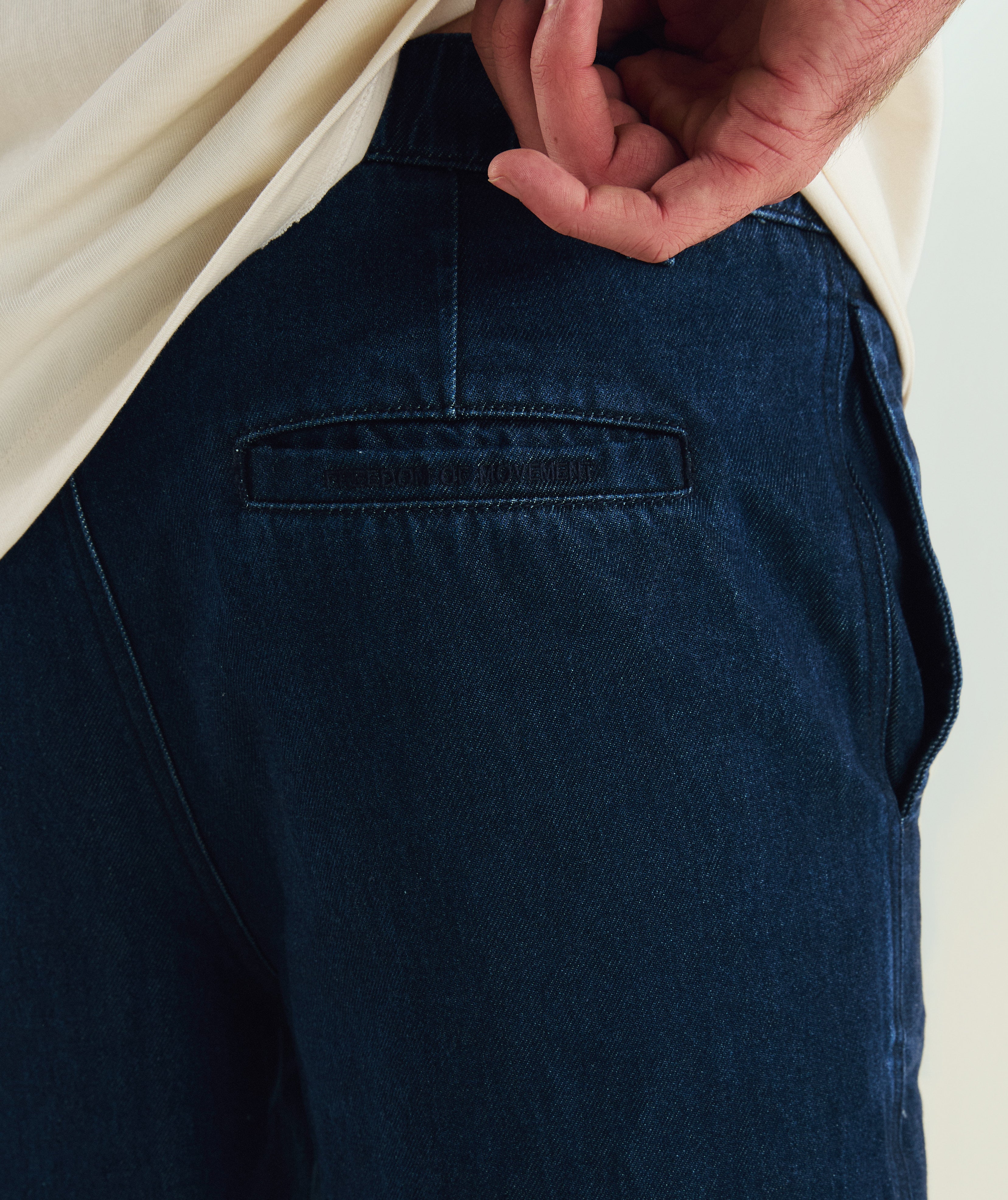 FOM x Kolisi cotton twill shorts in dark indigo, on-model view