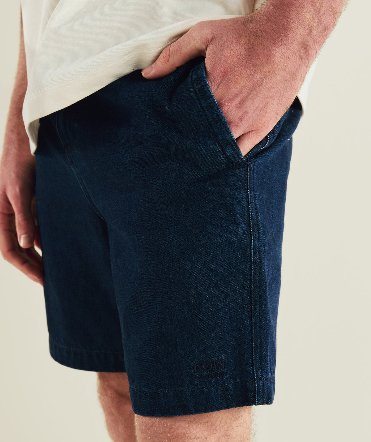 FOM x Kolisi cotton twill shorts in dark indigo, on-model view