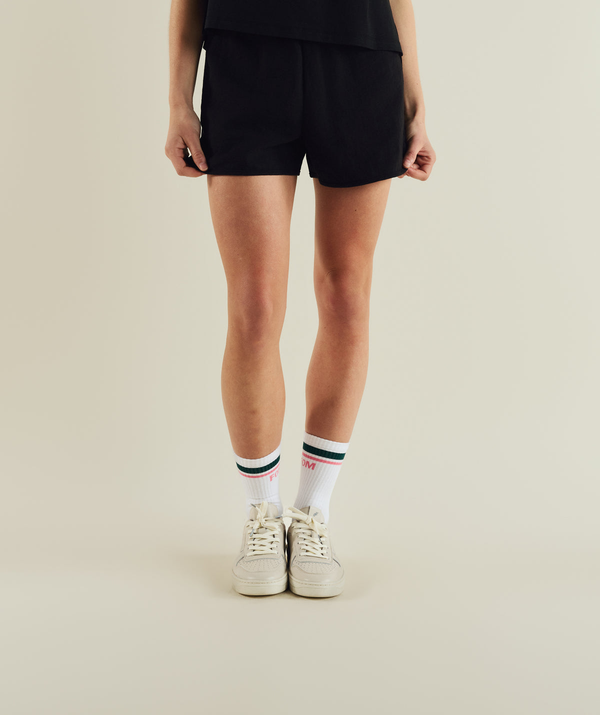 Woman wearing FOM ladies elasticated shorts in black