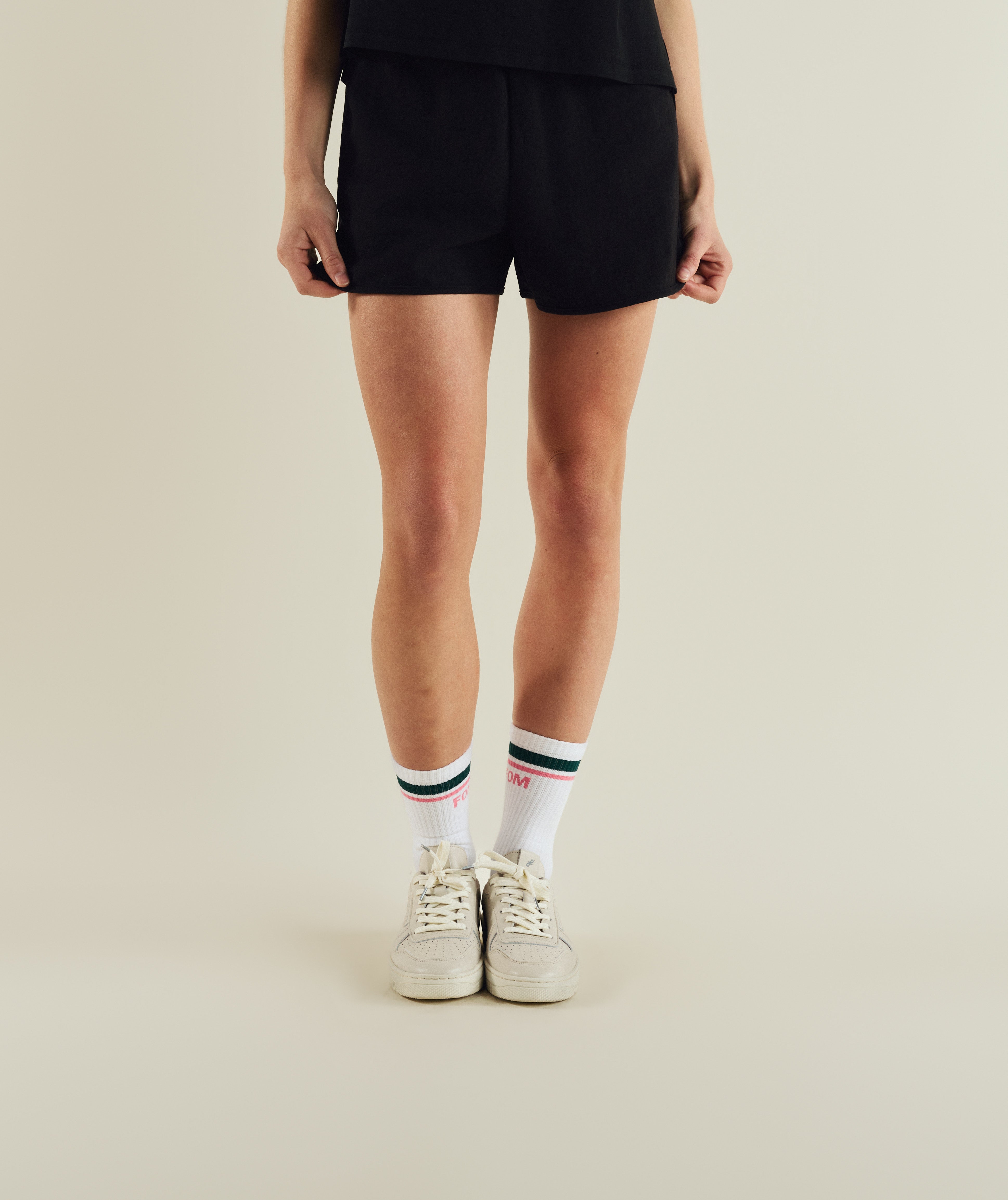 Woman wearing FOM ladies elasticated shorts in black