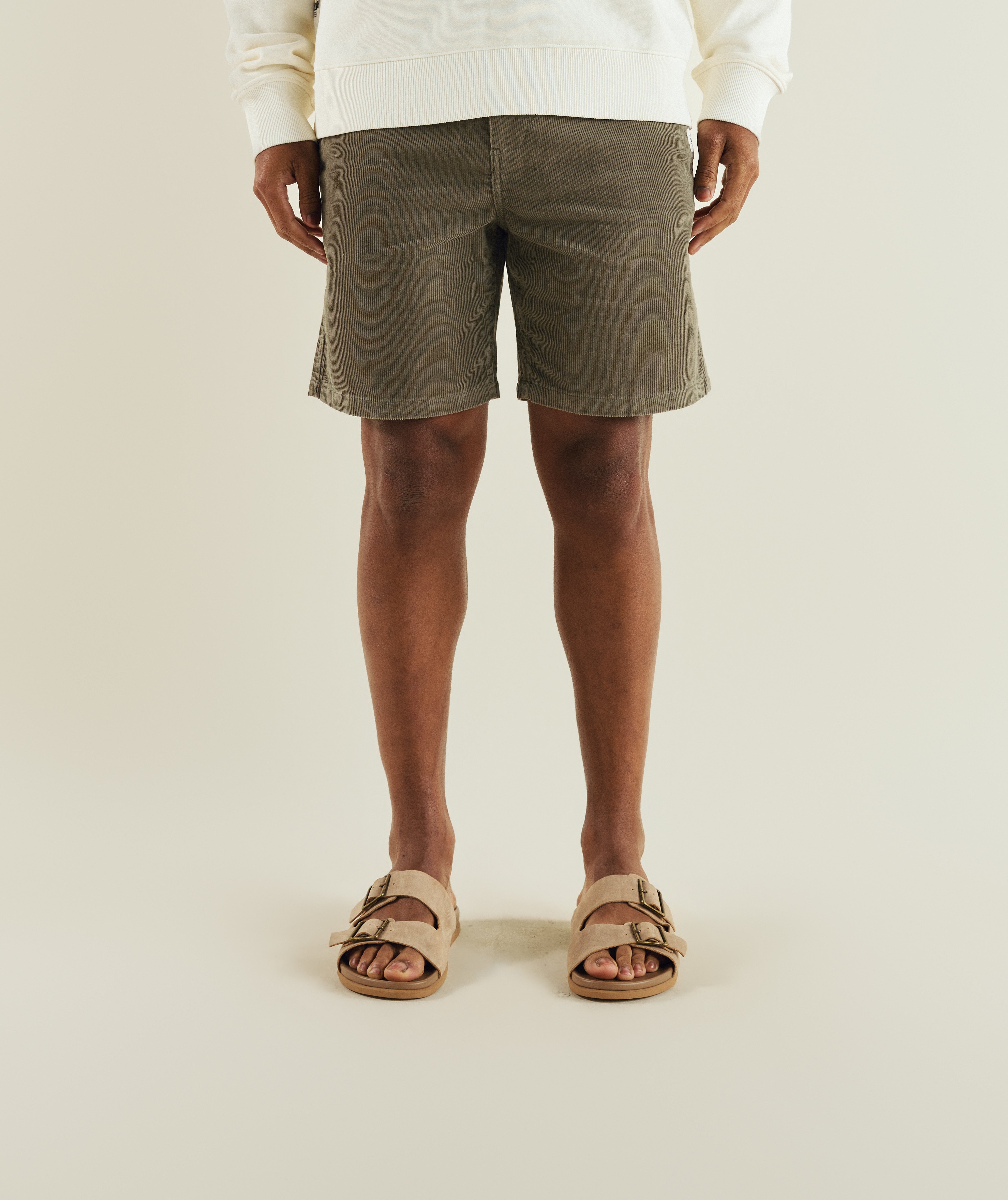 Man wearing FOM regular fit corduroy shorts in sage