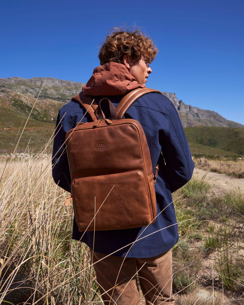A FOM leather backpack on an outdoor adventure.