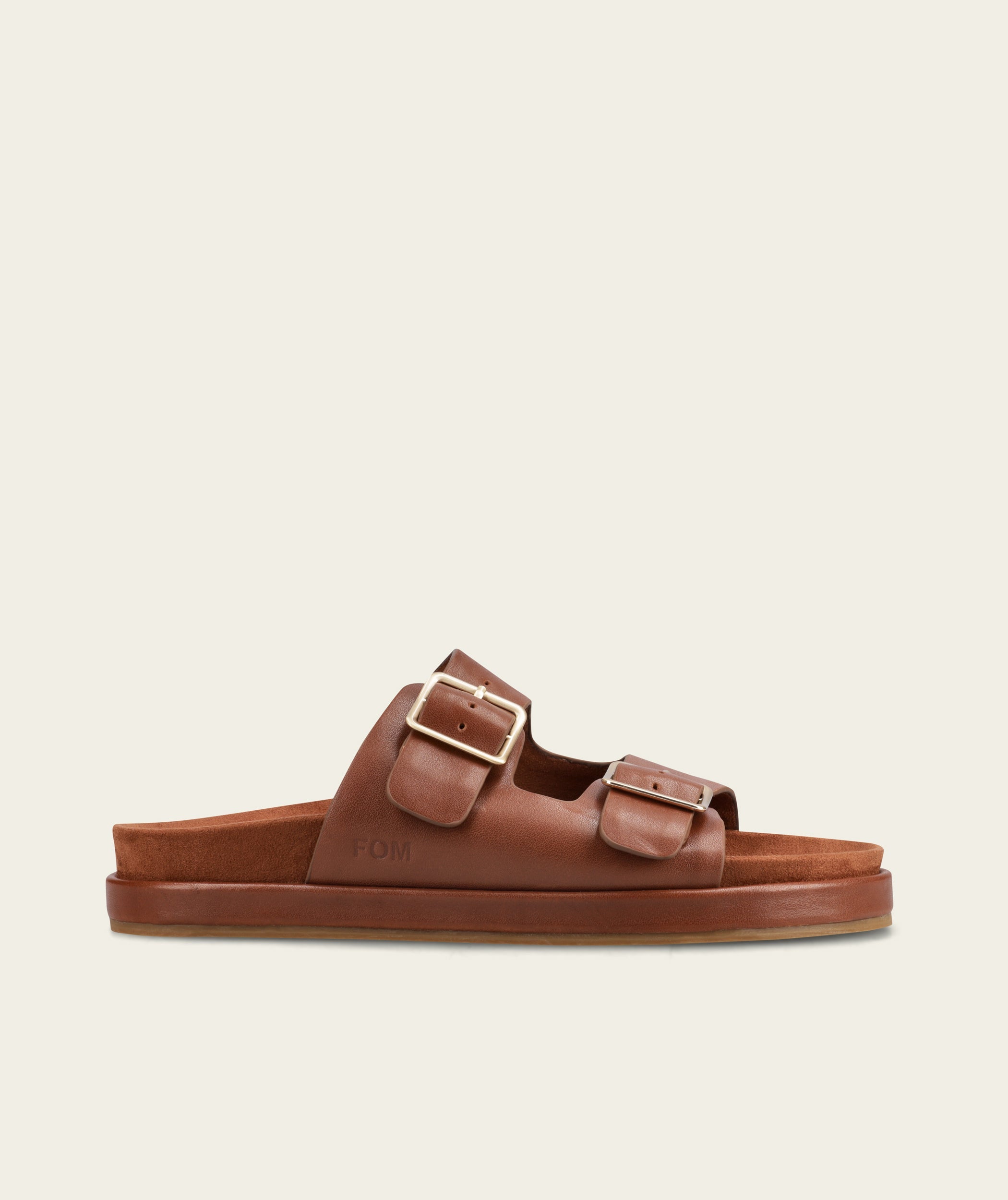 FOM Dani ox choc leather slide sandal, side profile showing the two adjustable buckle straps and moulded footbed