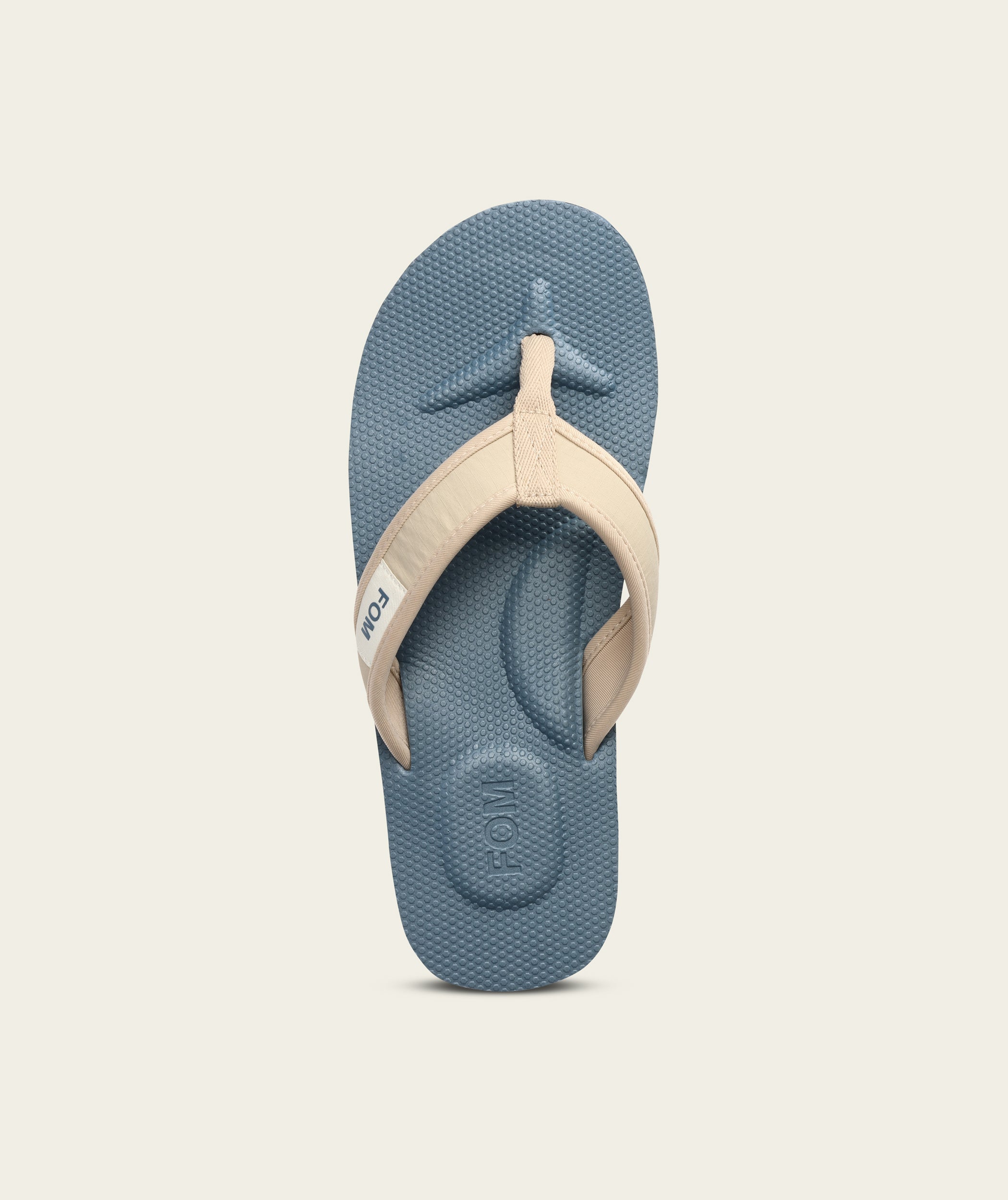 FOM mens adventure flop in sand and ocean, top view